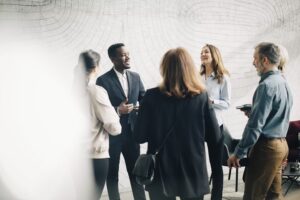 multiracial people in a business context discussing